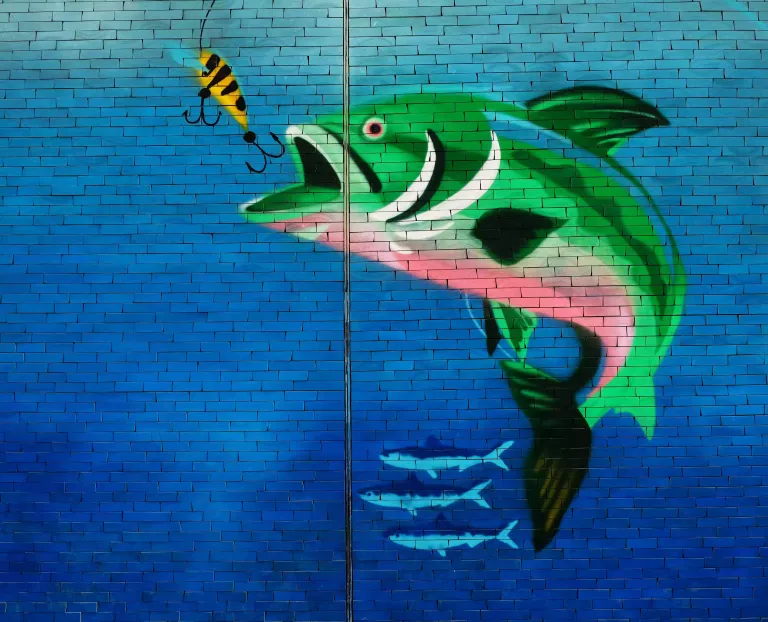 Phishing Scams: Deep Fakes Get Real - A mural of a colourful fish taking bait on a hook