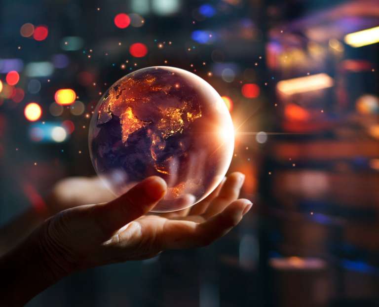 A crystal globe in an outstretched hand and backlit by electric lights: The future for Network Managers is automated – and regulated